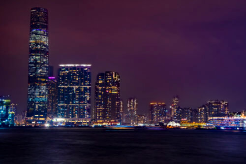 Hong Kong city by night skyscrapers, water reflection, Artur Rydzewski photography