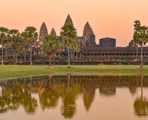 Angkor Wat Temple Cambodia old ruins trees palms long way visit trip sun rise sunset sky orange